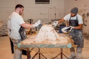 image of fibrous plaster casting with two plasterers